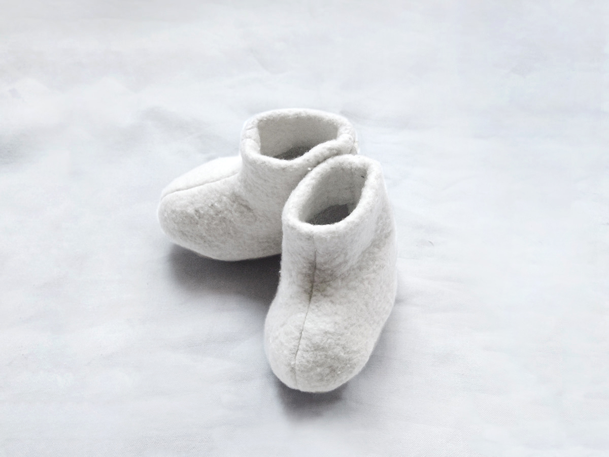 white newborn booties